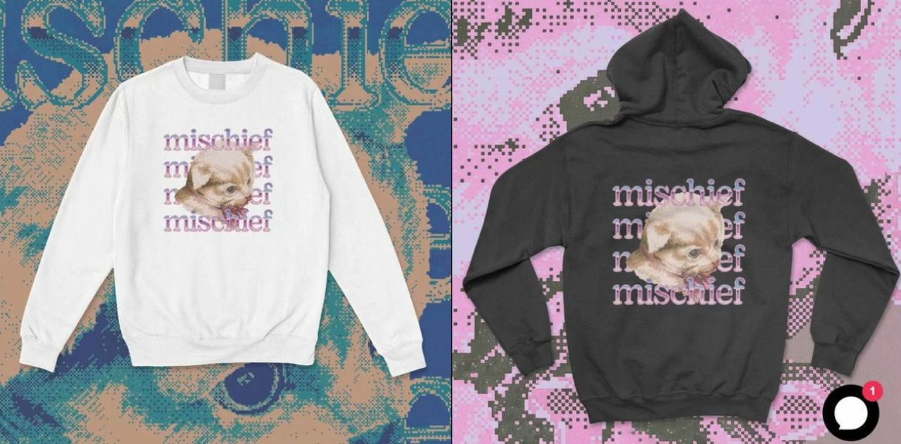 a couple of sweatshirts with a cat on it